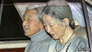 Japan's Emperor Akihito (L), with Empress Michiko, sits in a car on their way to a hospital in Tokyo on 6 November 2011