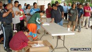 People wait to vote