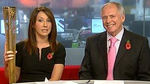 Midlands Today presenters Suzanne Virdee and Nick Owen with one of the Olympic torches