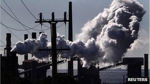 Vapour rise from a steel mill chimney in the industrial town of Port Kembla, about 80 km (50 miles) south of Sydney, in this file photo taken July 7