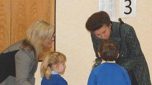 Princess Anne being given a posy of flowers