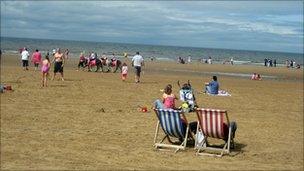 Blackpool beach showing holidaymakers