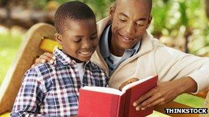 father and son reading