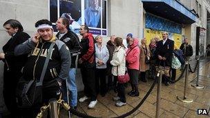 Crowds queue outside the Queens Hotel in Leeds to pay respect to Sir Jimmy Savile