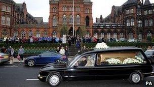 Staff lined outside Leeds General Infirmary as the funeral procession of Sir Jimmy Savile passes