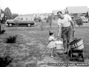 dad and daughter on front lawn