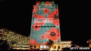 A building in London lit up with poppies