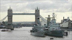 HMS Belfast (right) moored on the River Thames