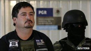 Ovidio Limon Sanchez presented to the media by masked soldiers in Mexico City