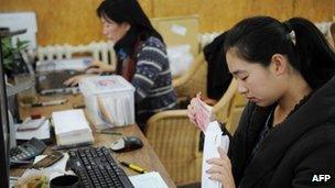 Ai Weiwei's staff count donations at his studio