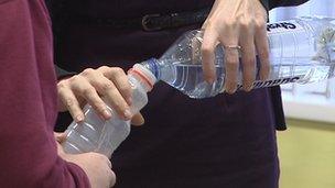 Pupil's water bottle being filled