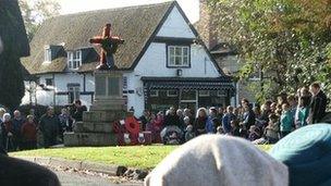 People gather on Remembrance Sunday in Prestbury