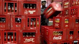 Coke bottles being stocked