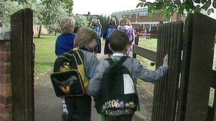 Children enter school grounds