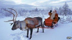 Santa Claus and reindeer in Rovaniemi