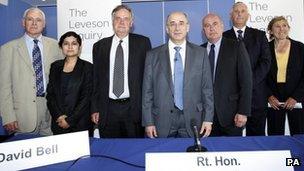 (Left to right) George Jones, Shami Chakrabarti, David Bell, Lord Justice Leveson, David Currie, Paul Scott-Lee and Elinor Goodman