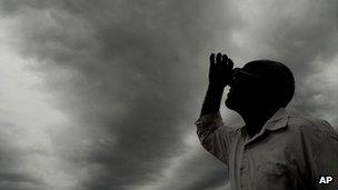 Man watching the formation of monsoon clouds (Image: AP)