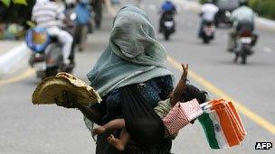 A woman selling flags in an Indian city