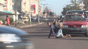 One of the characters in the film, Vasco Covane, crosses a busy street in Mozambique's capital Maputo