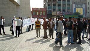 People with slogans in Baghdad's Tahrir Square