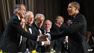 Italian Ambassador Giulio Terzi di Sant'Agata shakes hand with US President Barack Obama in Washington, 29 October