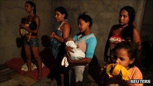 Women and children from Brazil's "Roofless Movement" in an empty building they have occupied in Sao Paulo