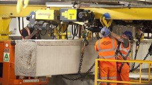 Concrete block being lifted out