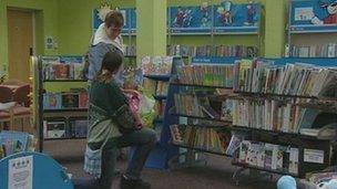 People chatting inside a library