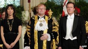 David Cameron (R) at the Lord Mayor's banquet in London, with his wife Samantha (L) and Lord Mayor of London David Wootton (C)