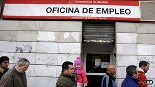 Workers queuing at a job centre in Madrid