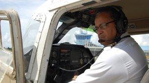 Captain Gouveia in an airplane cockpit