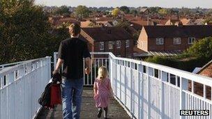 A man and his daughter on a council estate in Derby