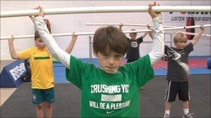 Boys doing stretch exercise