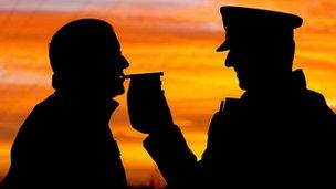 Driver does a breathalyser test with an officer