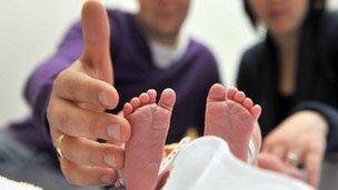 Baby's feet and parents