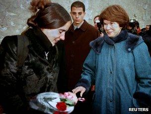 Danielle Mitterrand offers a rose to Mazarine Pingeot at a private family reunion in Jarnac, southern France, 11 January 1997