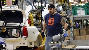 Worker on the Cadillac production line at the General Motors plant in Lansing, Michegan