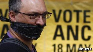 A protester looks on outside the ruling African National Congress (ANC) headquarters, during a protest against the passing of new laws on state secrets in Johannesburg, November 22, 2011.