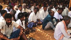 Villagers protesting outside church