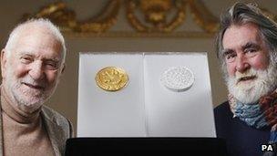 Sir Anthony Caro [L] and Tom Phillips with their gold and silver Olympic UK Kilo coins