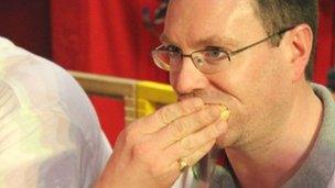 Joint winner Lee Palmer eating a mince pie during the contest