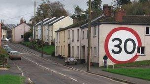 A Bow property with 15ft (4.5m) 30mph (48kmh) sign painted on it