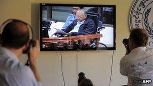 Journalists photograph former Khmer Rouge deputy prime minister and minister of foreign affairs Ieng Sary on Wednesday