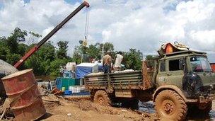 Dock workers unloading goods at Port Kaituma