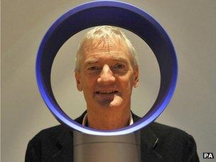 Sir James Dyson looks through a bladeless fan