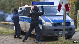 Protesters attack a police car near Metzingen, Germany, 25 November