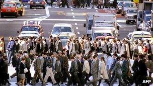 File image of residents and workers crossing the street in Tokyo