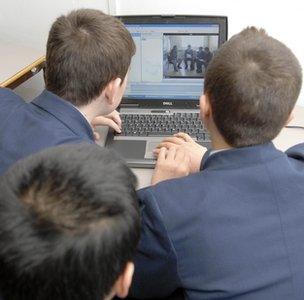 Children at school with a computer