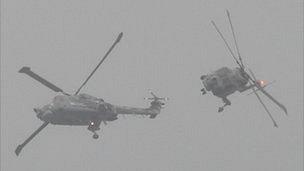 Black Cats helicopters performing in low cloud and mist during the 2011 Guernsey Battle of Britain Air Display