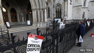 Placards outside the High Court